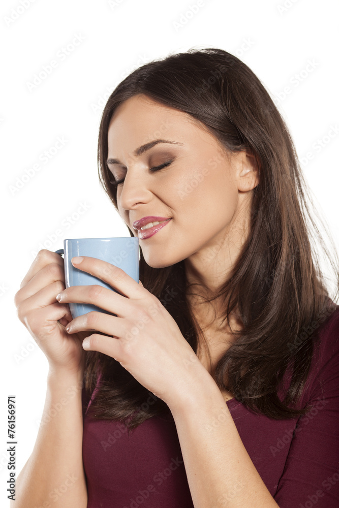 happy young woman enjoying the smell of morning coffee happy young woman enjoying the smell of morning coffee