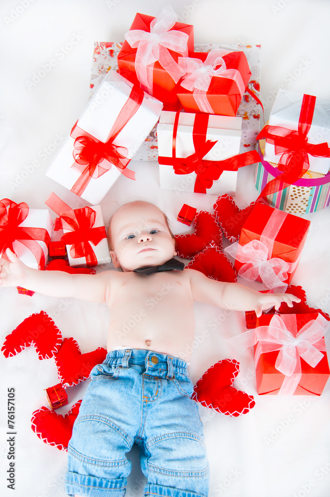 Boy with a gift box and hearts. Valentine day concept