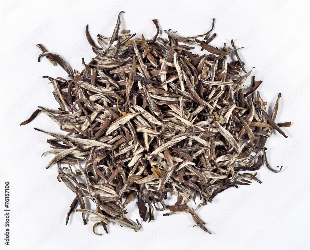 Heap of green tea leaves on a white Heap of green tea leaves on a white