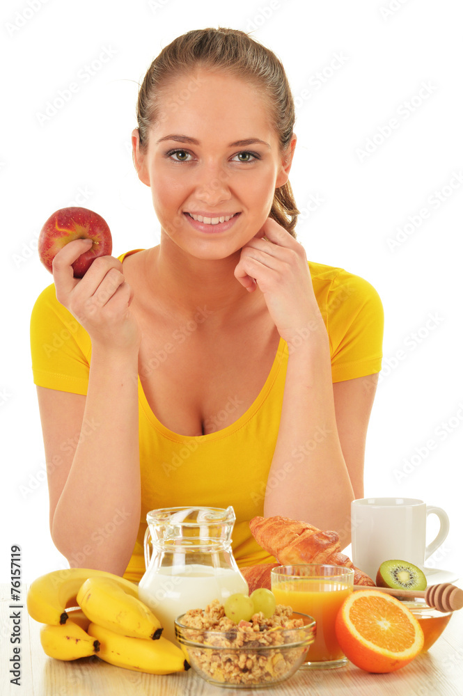 Young woman having breakfast. Balanced diet Young woman having breakfast. Balanced diet