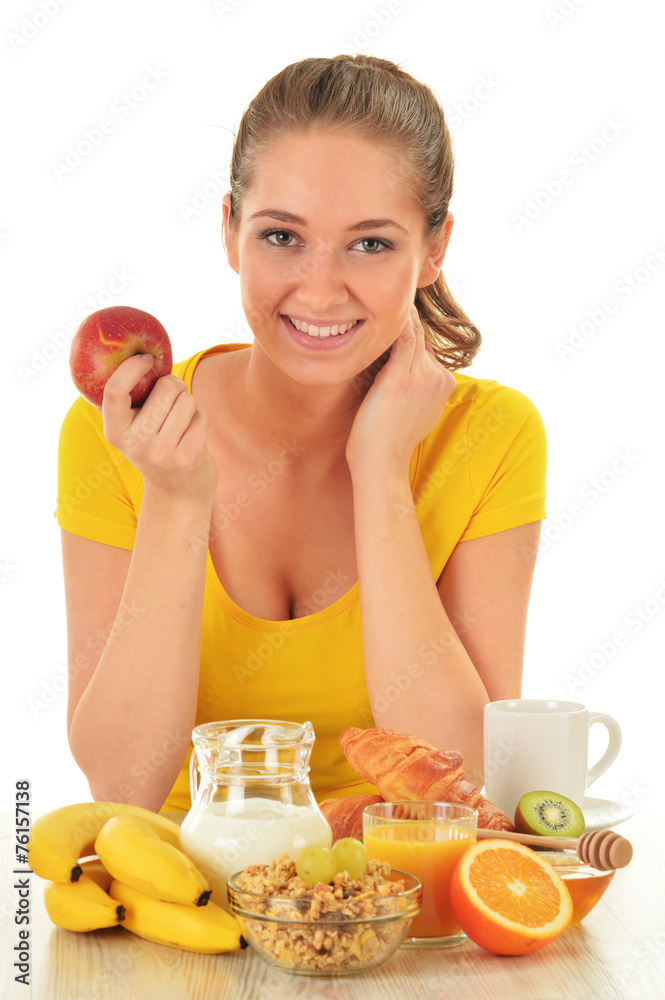 Young woman having breakfast. Balanced diet Young woman having breakfast. Balanced diet