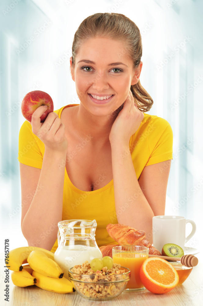 Young woman having breakfast. Balanced diet Young woman having breakfast. Balanced diet