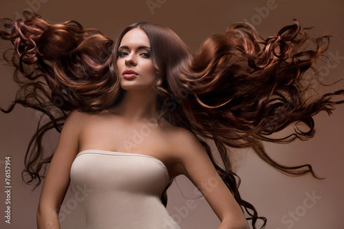 Portrait of Beautiful Woman with Long flying Hair.