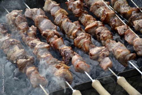 Pork meat on grill and coal