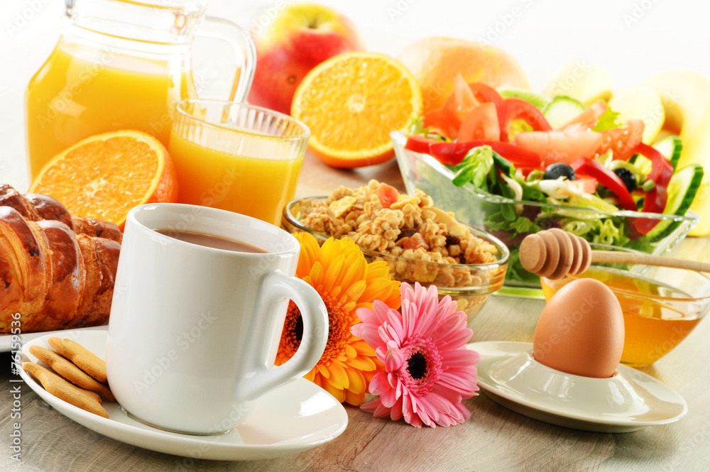 Breakfast with coffee, juice, croissant, salad, muesli and egg Breakfast with coffee, juice, croissant, salad, muesli and egg