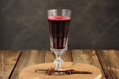 Cherry mulled wine in antique tall glass