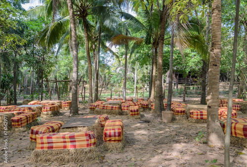 Outdoor table and chair make use of rice straw