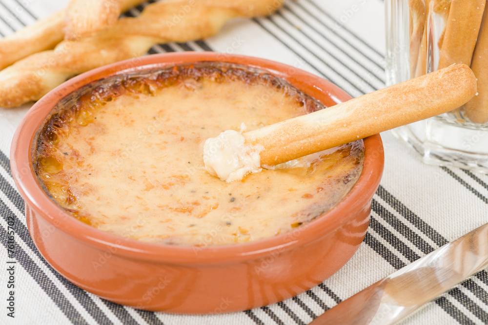 Baked Cheese - Melted cheese dip served with breadsticks. Baked Cheese - Melted cheese dip served with breadsticks.
