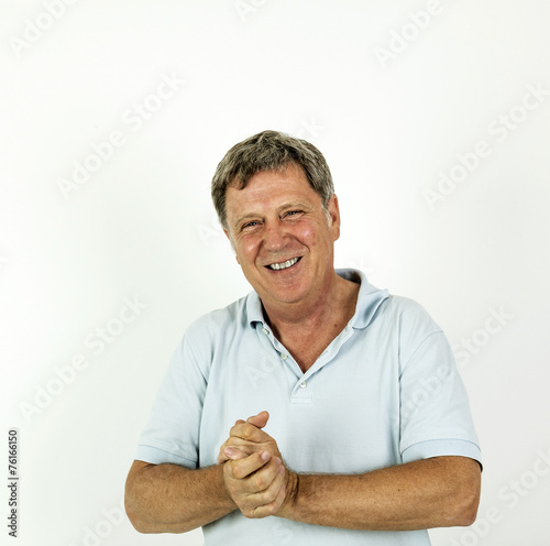 handsome smiling man in blue leisure polo shirt © travelview