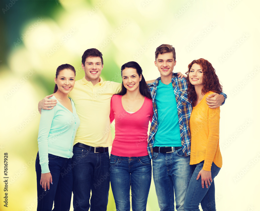 group of smiling teenagers over green background group of smiling teenagers over green background