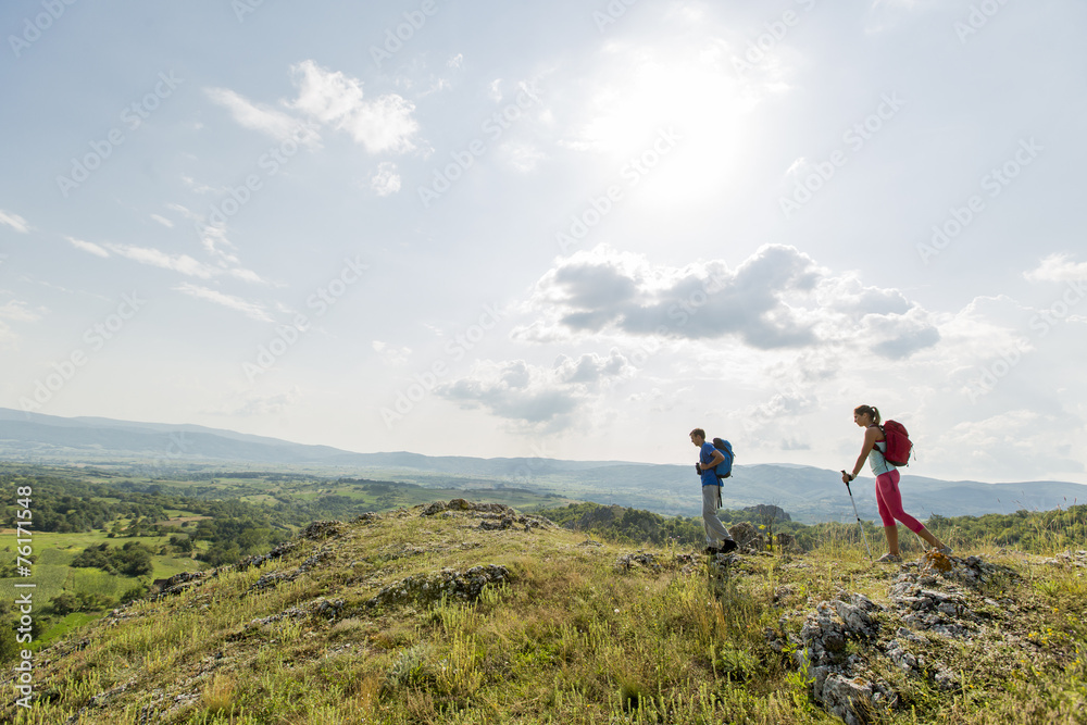 Young couple hiking on the mountain