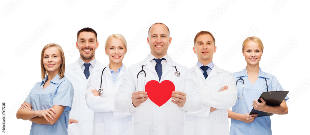 group of smiling doctors with red heart shape group of smiling doctors with red heart shape