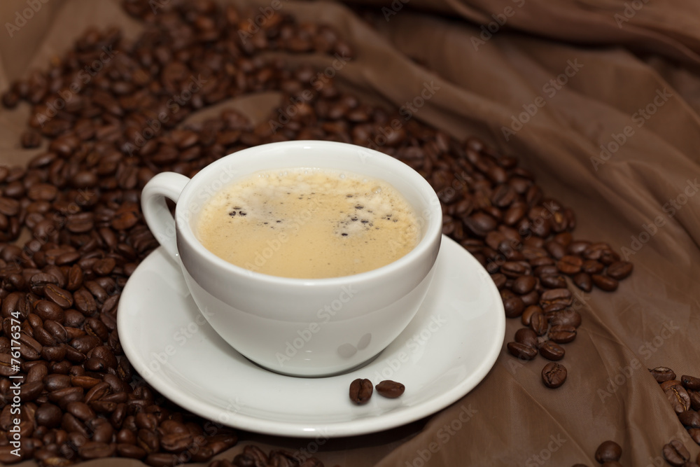 Coffee cup and beans. Selective focus. Coffee cup and beans. Selective focus.