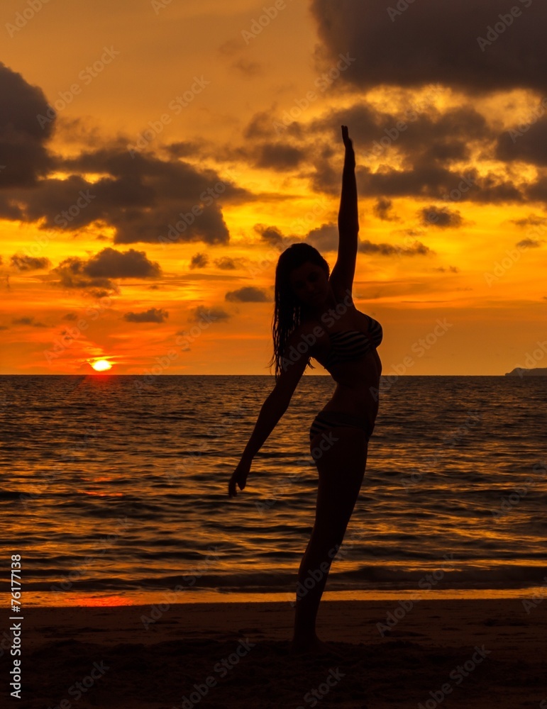 girl posing with sunset on beach, silhouette, summer time