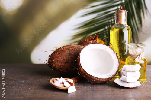 Coconuts and coconut oil on wooden table