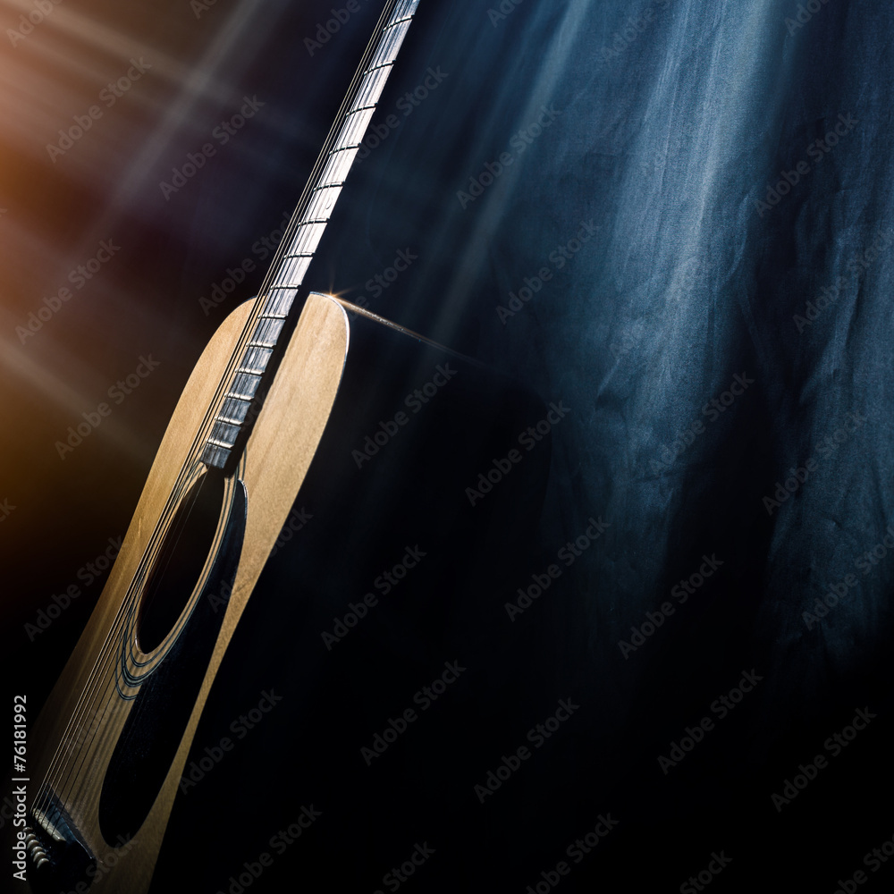 Naklejka premium guitar on a black background