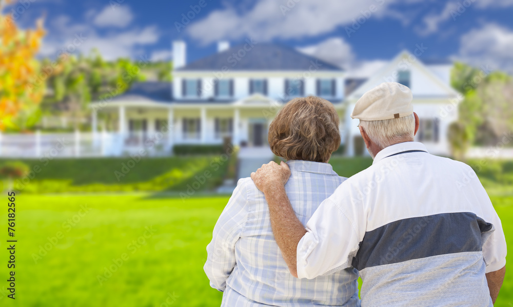 Happy Senior Couple Looking at Front of House Happy Senior Couple Looking at Front of House