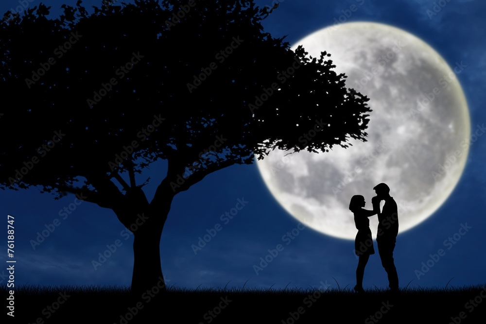 Guy kiss girl hand on full moon silhouette background