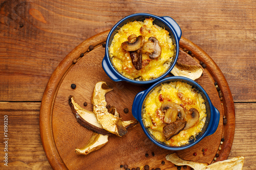 Moshroom casserole in a blue ceramic pot photo