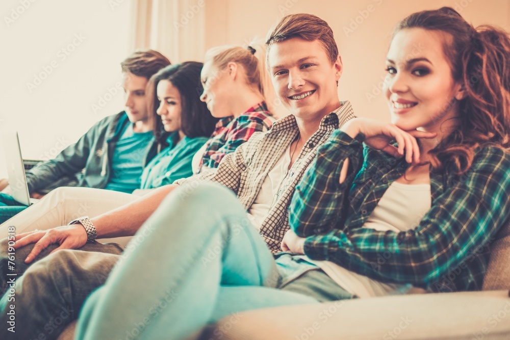 Group of students preparing for exams in apartment interior Group of students preparing for exams in apartment interior