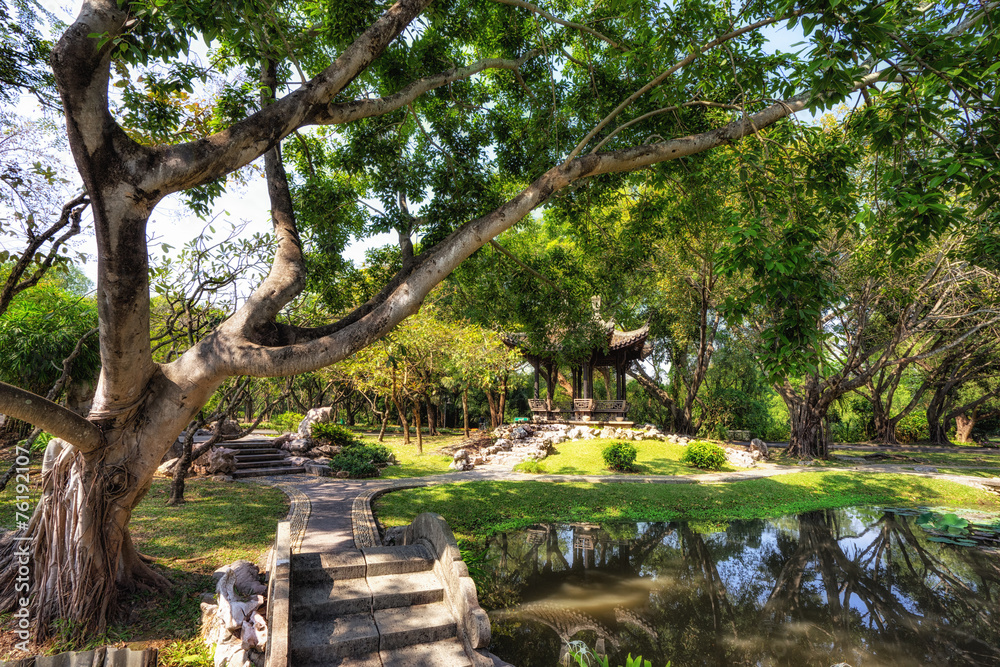 Fototapeta premium Chinese classical garden with pavilions and pond