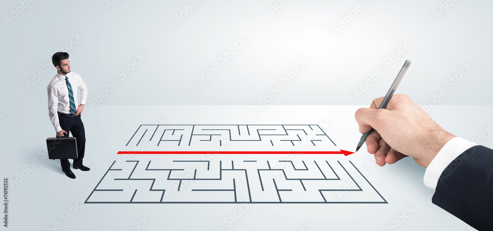 Business man looking at hand drawing solution for maze Business man looking at hand drawing solution for maze