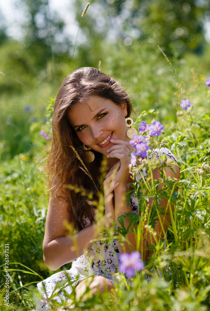young sexy girl with flowers in the field young sexy girl with flowers in the field