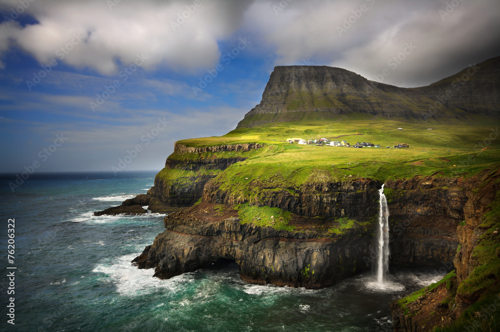 Gasadalur village in Faroe Islands. Cliffs and waterfall. - obrazy, fototapety, plakaty 