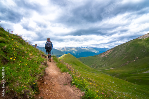 Trekking in the mountains of a little girl © michelangeloop