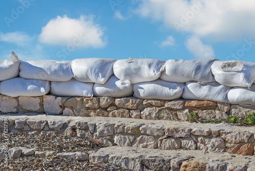 sandbags under clouds