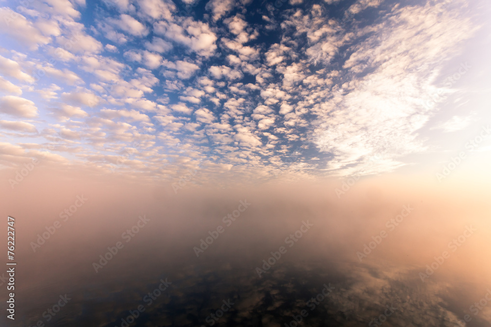 misty morning on the river and clouds reflected in water misty morning on the river and clouds reflected in water