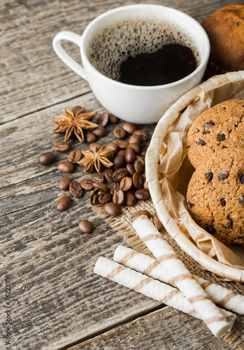 coffee and cookies on wood background