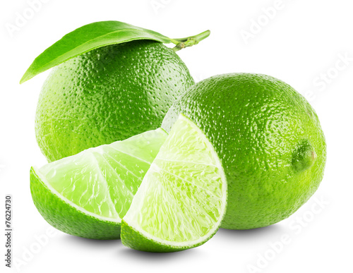 Lime with slices and leaf isolated on white background