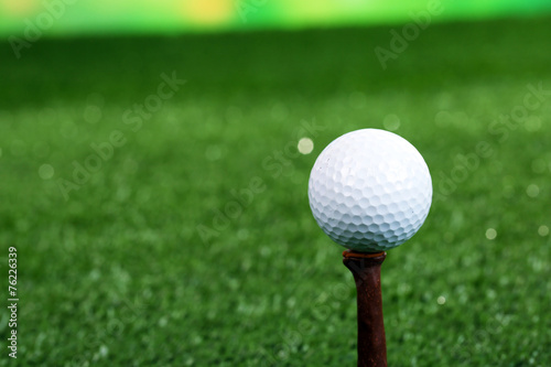 Golf ball on green grass outdoor close up