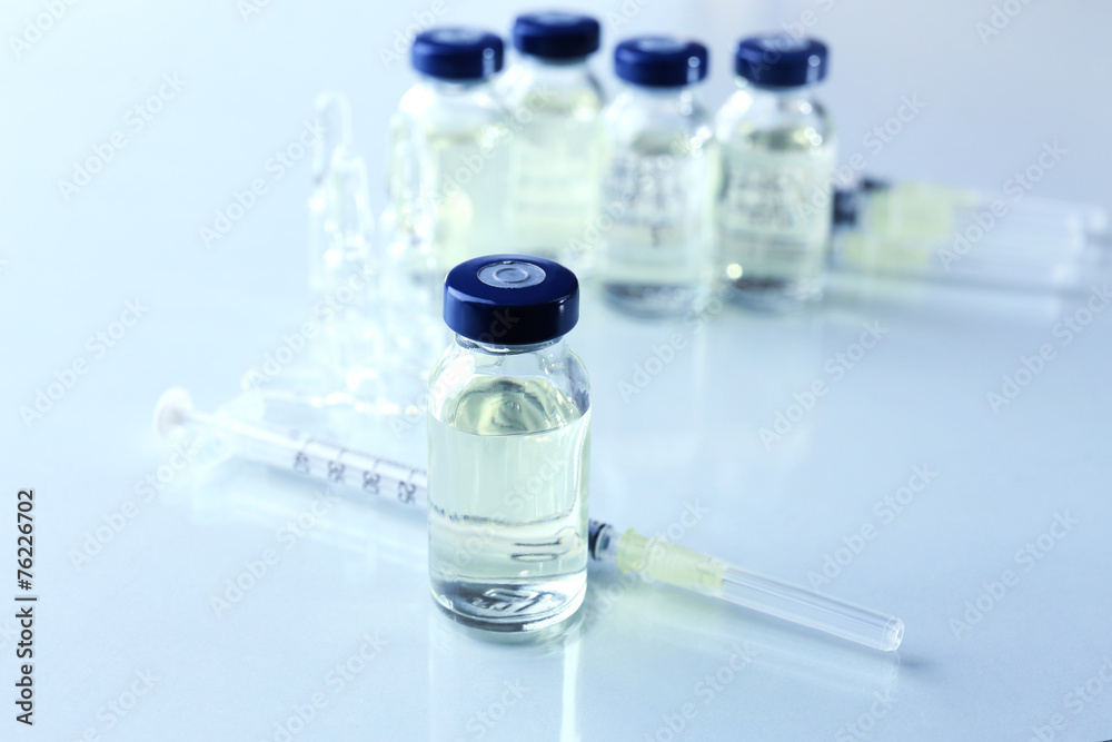 Vaccine in vial with syringe Vaccine in vial with syringe