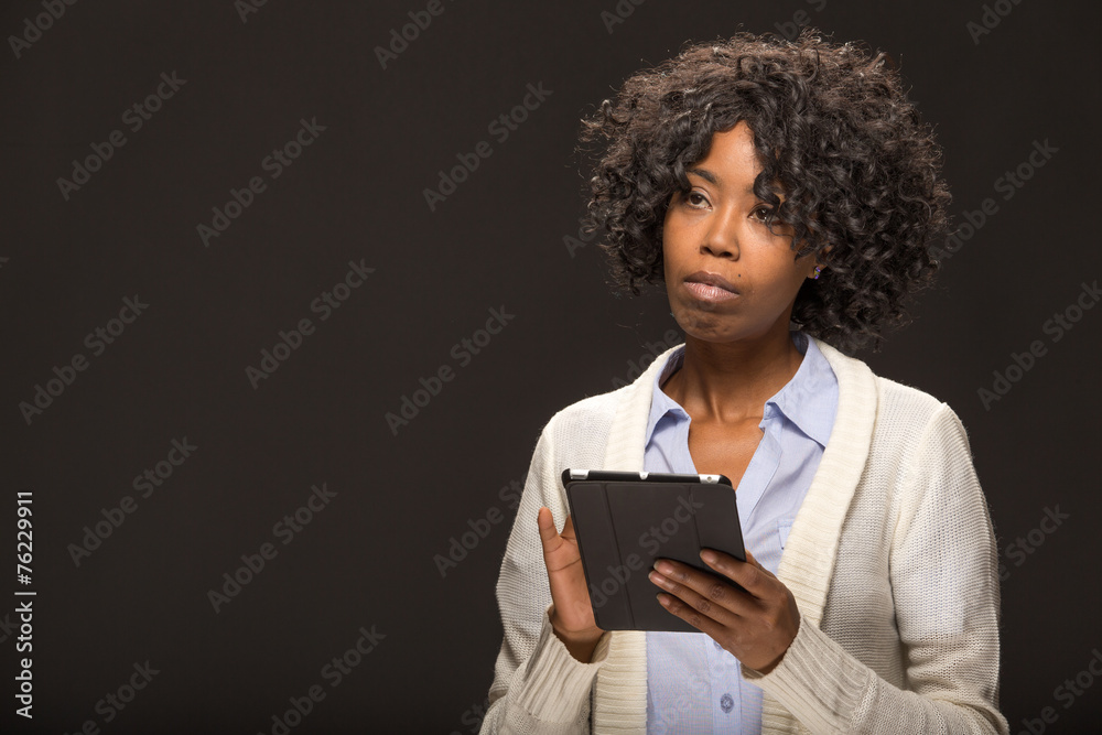 Young African American black woman using tablet pc Young African American black woman using tablet pc