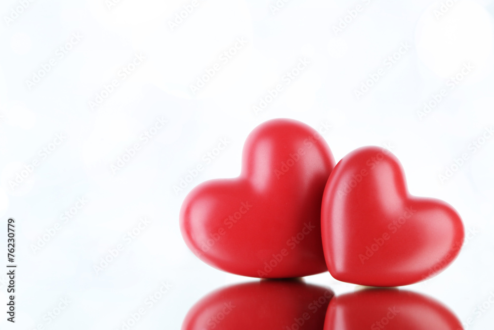 Red hearts on light background Red hearts on light background