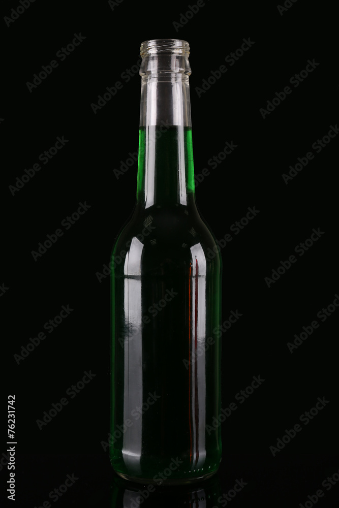 Colorful alcoholic beverages in glass bottle on dark background Colorful alcoholic beverages in glass bottle on dark background