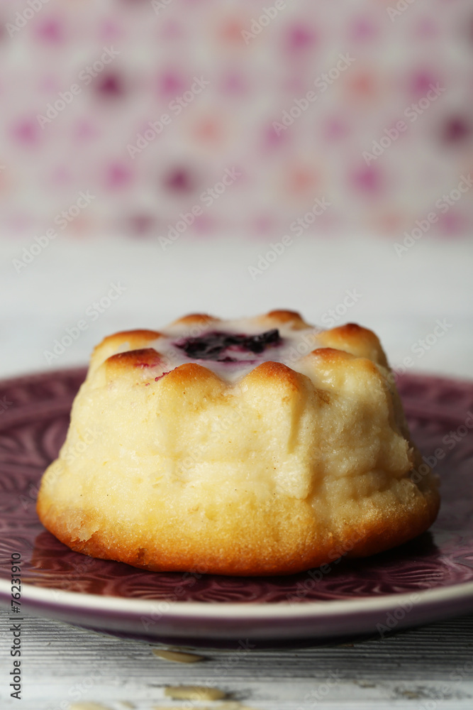 Delicious cheesecake on wooden table, on color background Delicious cheesecake on wooden table, on color background