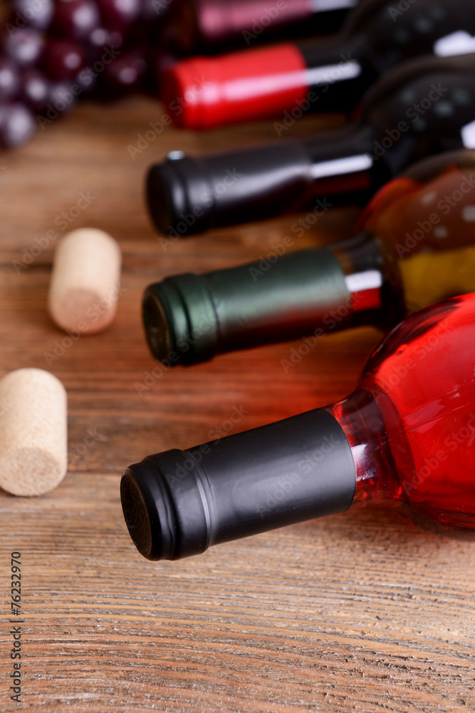 Different bottles of wine on table close-up Different bottles of wine on table close-up
