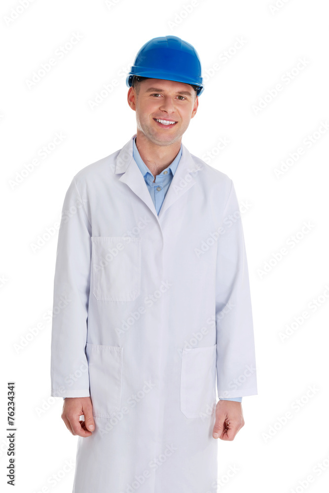 Man in a lab coat and helmet Man in a lab coat and helmet