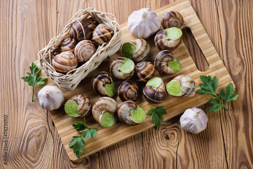 Escargots de Bourgogne, fresh parsley and garlic bulbs