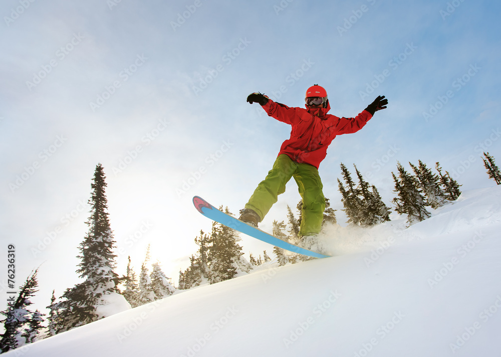 Snowboarder doing a toe side carve