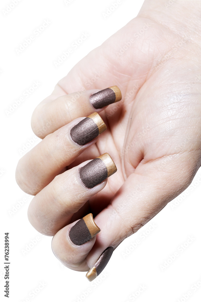 Hand with brown and gold color nail varnish Hand with brown and gold color nail varnish