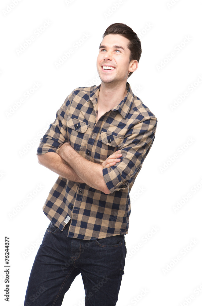 Happy young man smiling with arms crossed Happy young man smiling with arms crossed