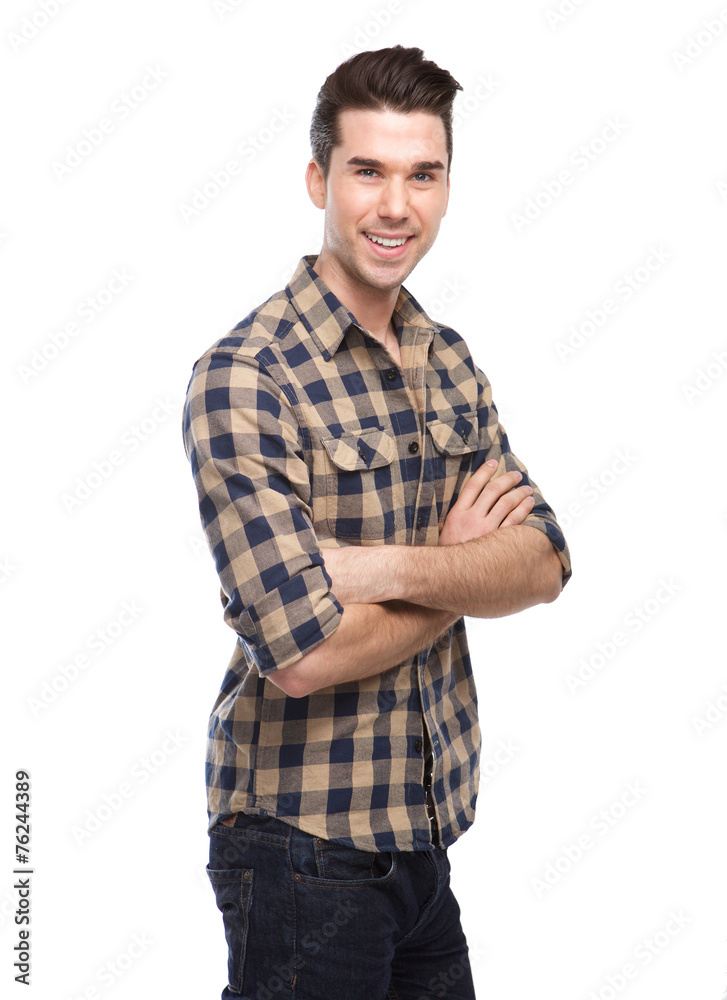Attractive young man smiling with arms crossed Attractive young man smiling with arms crossed