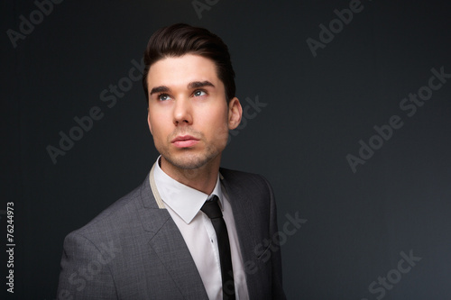 Cool young man in business suit and necktie