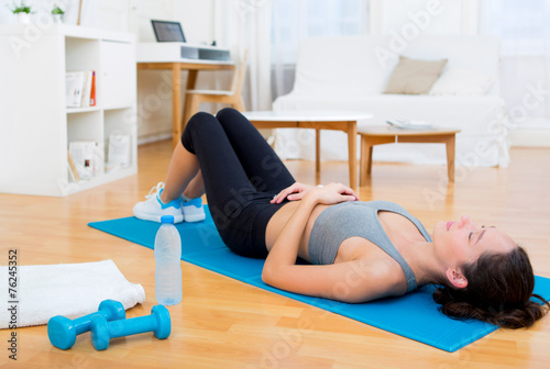 Young attractive woman having a rest after sport