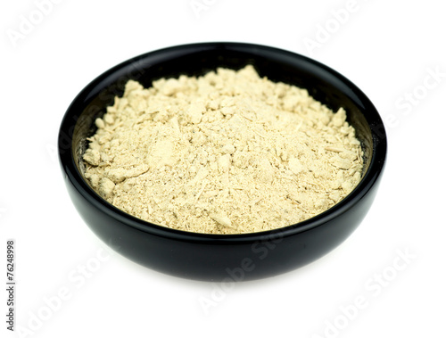 Kava root in bowl isolated on white