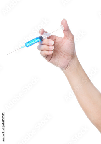 syringe in a hand on white background, isolated